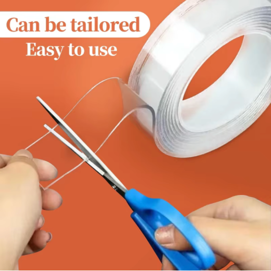 Person cutting a roll of white tape with blue scissors on an orange background