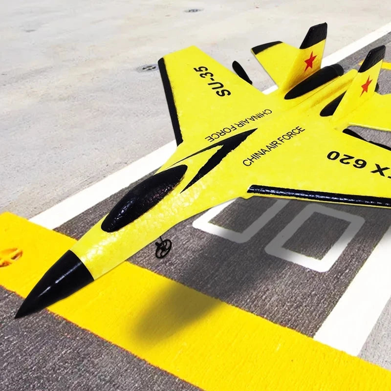 Yellow model airplane with black accents on a runway