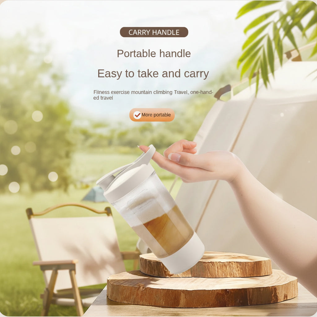 Hand holding a portable cup with a scenic background